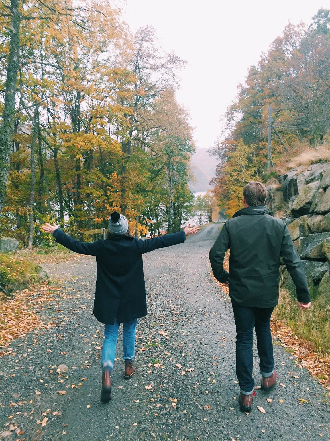 Couple Walking Through Fall Trees