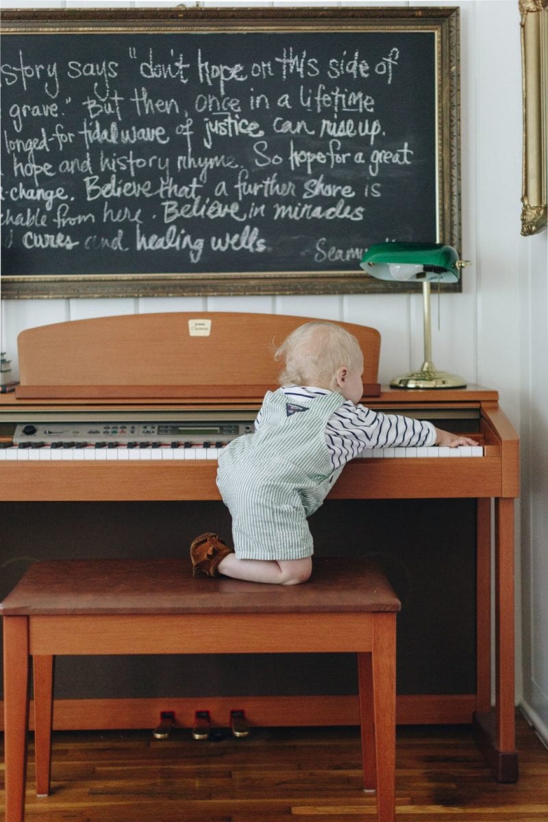 baby climbing on a piano golden rule wit & delight