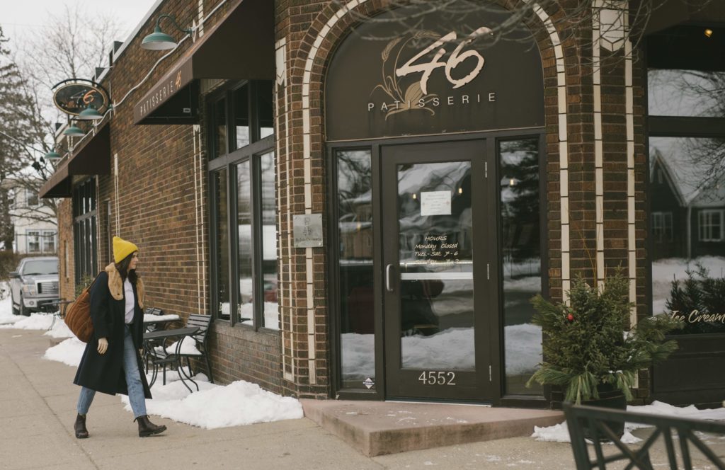 Kate Arends walking into coffee shop Wit & Delight