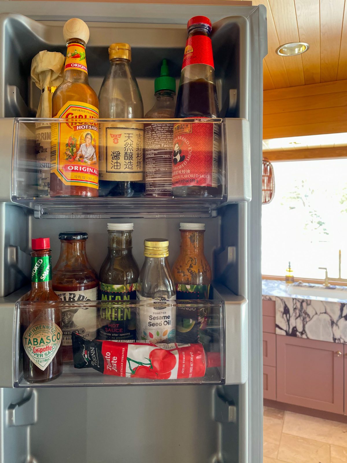 Fridge organization. Side shelves with cooking sauces.