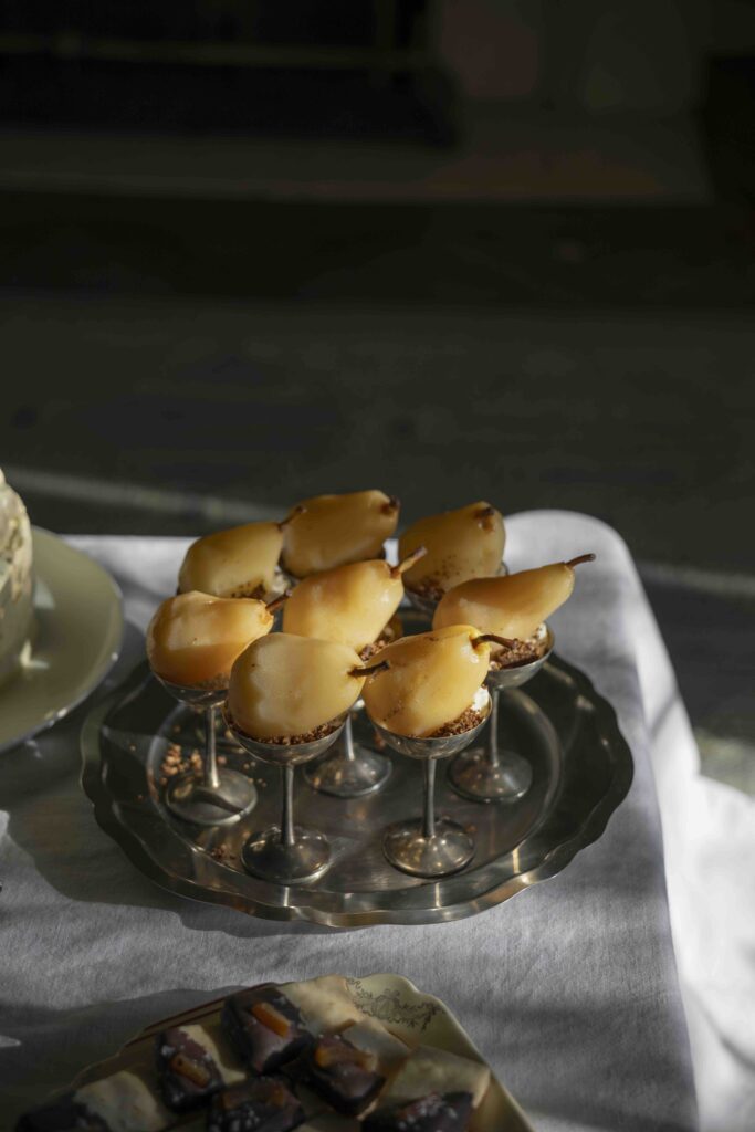 Poached pears with whipped brie frosting and cinnamon oat crumble