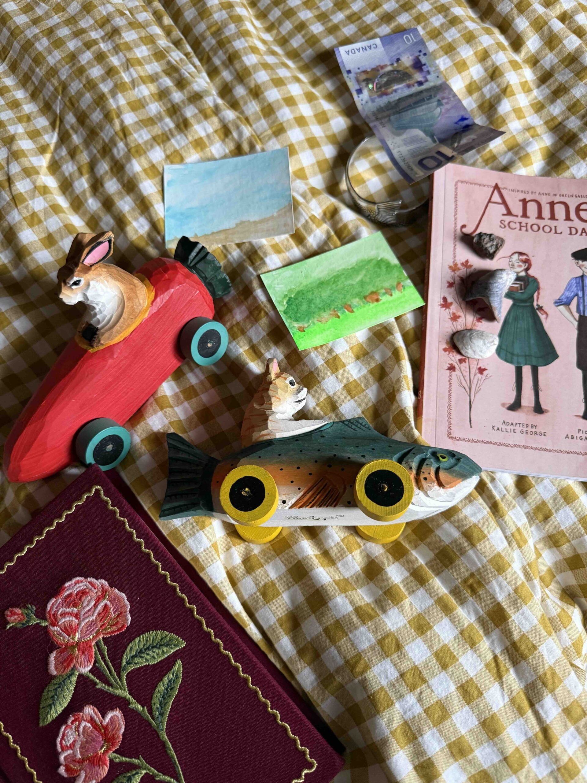 Carved wood racecar figurines from a Prince Edward Island gift shop